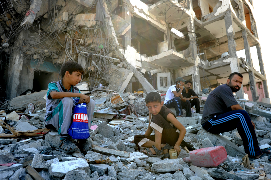 Palestinians searches through rubble