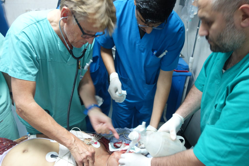 Mads Gilbert treats a wounded, pregnant Palestinian woman at the Shifa hospital in Gaza, July 2014. Photo: Private